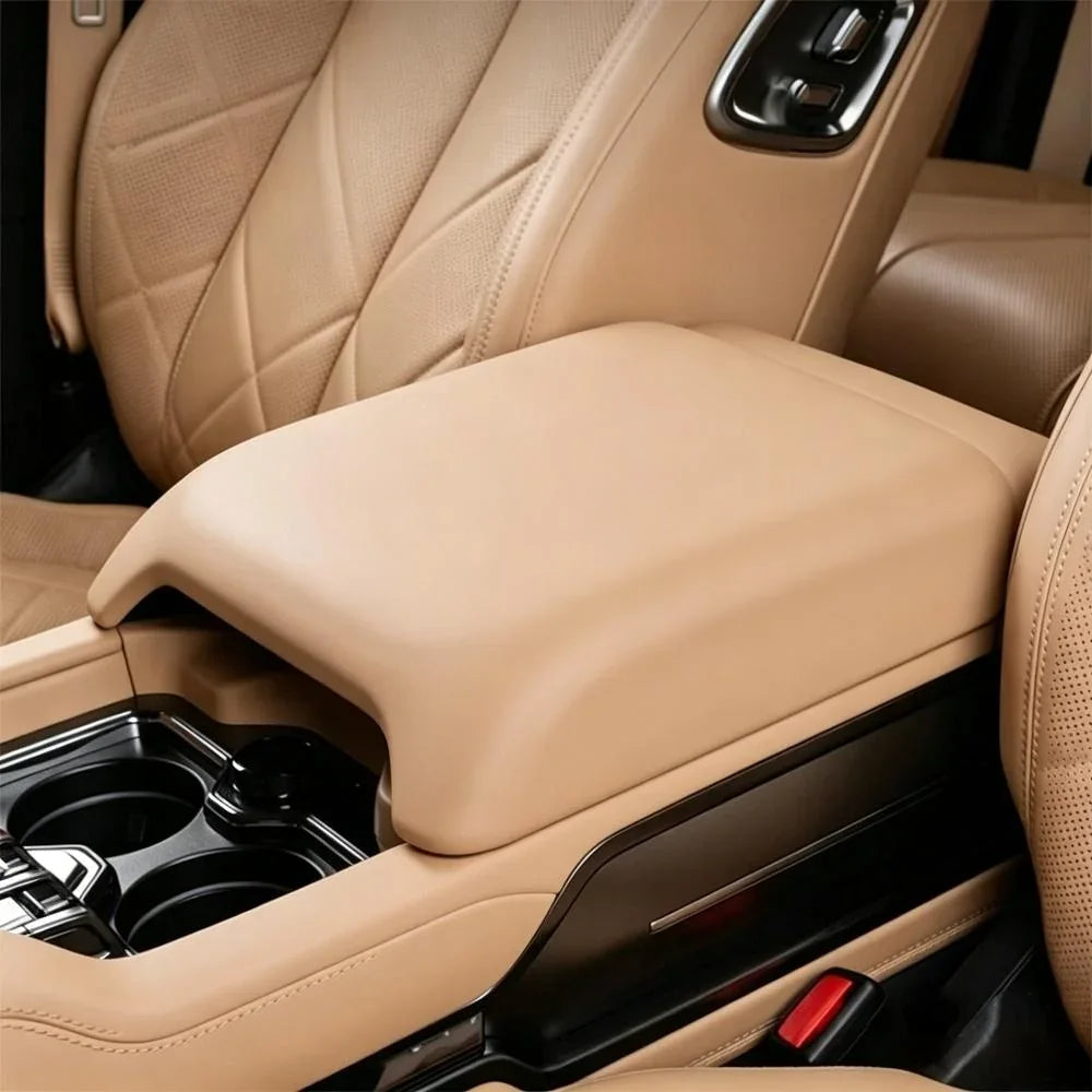 Premium tan leather center console armrest for BYD, featuring a smooth, ergonomic design.