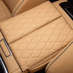 Tan quilted faux leather center console armrest cover for premium car interior protection.