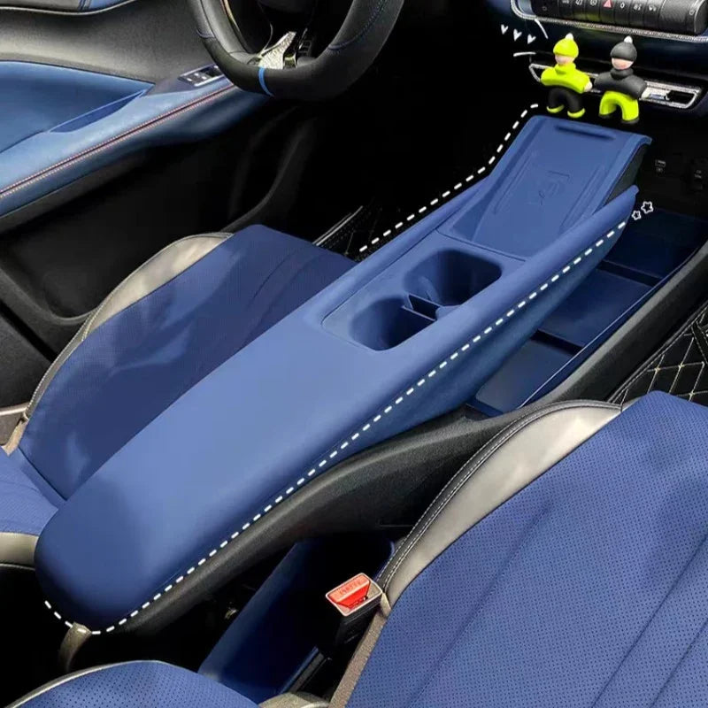 Blue leather center console armrest cover with white contrast stitching for BYD interior.