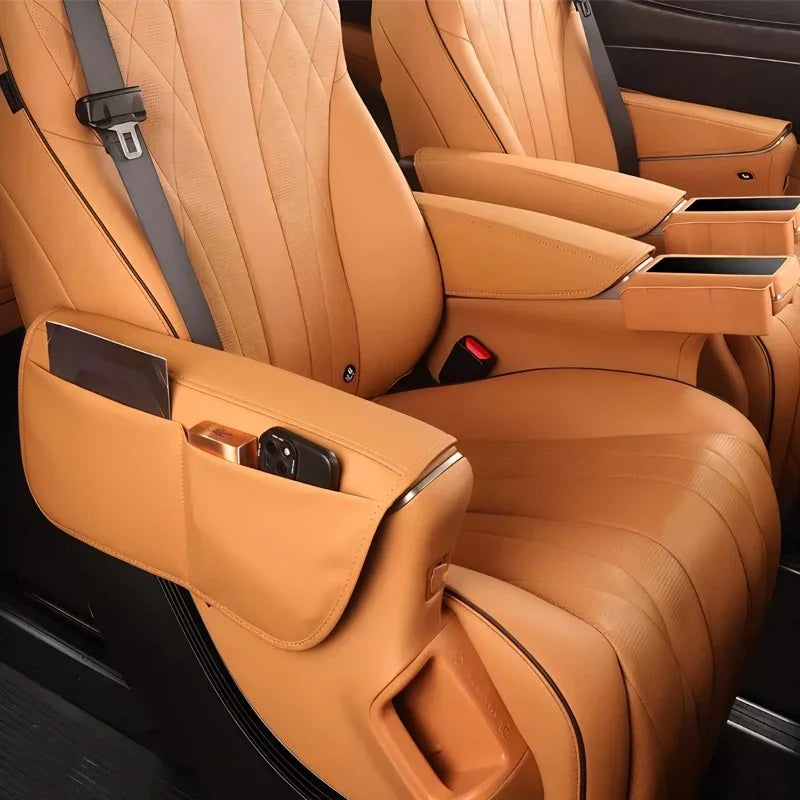 Tan leather car seats featuring diamond-stitched patterns and integrated side-pocket organizers.