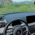 Blue textured dashboard cover for BYD car interior with geometric pattern.