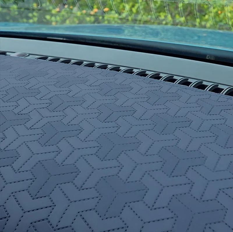 Grey leather dashboard cover for BYD featuring a unique geometric stitched pattern.