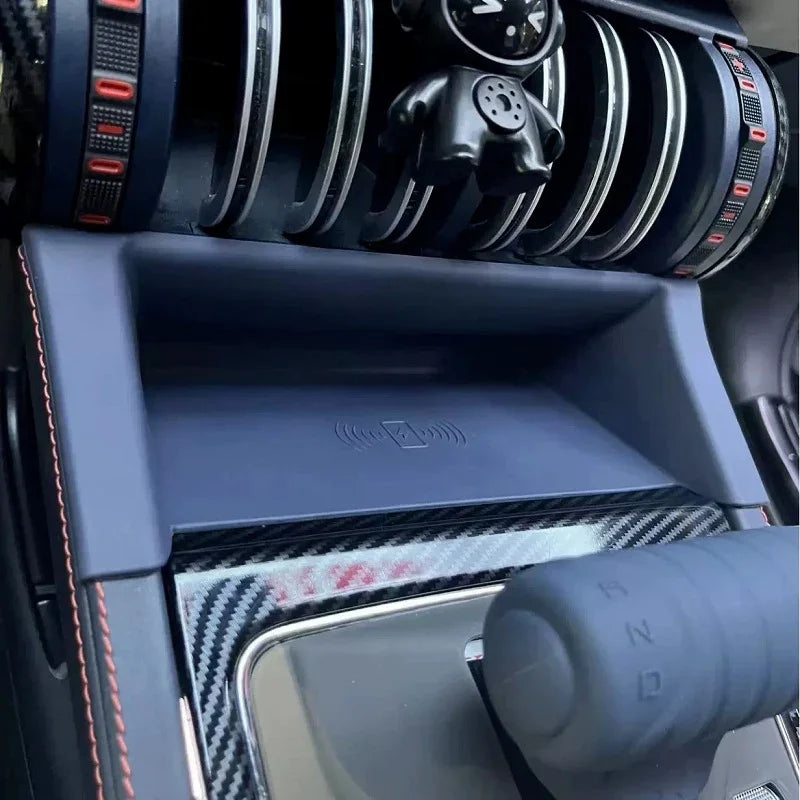Navy blue non-slip center console tray with integrated wireless charging pad for BYD interior.