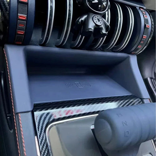 Navy blue non-slip center console tray with integrated wireless charging pad for BYD interior.