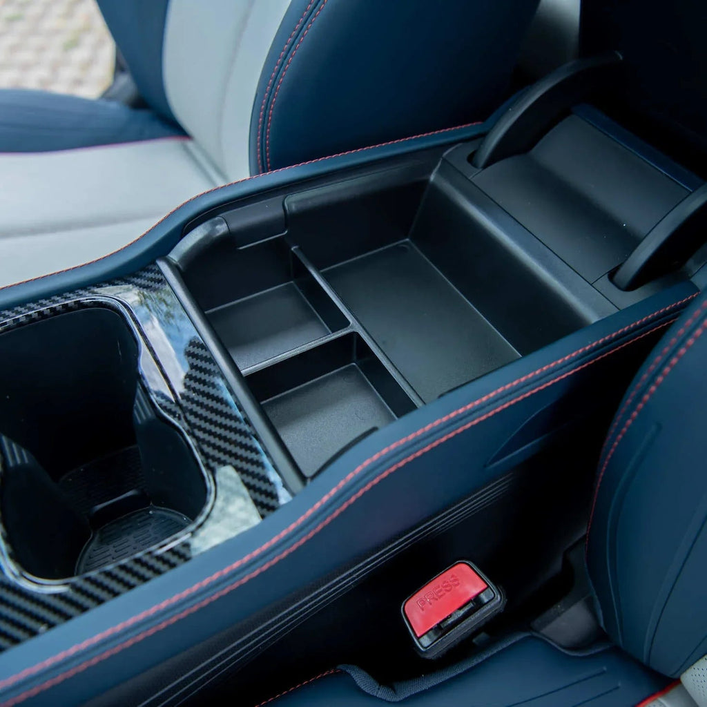 Black carbon fiber patterned center console organizer with red stitching for BYD interior.
