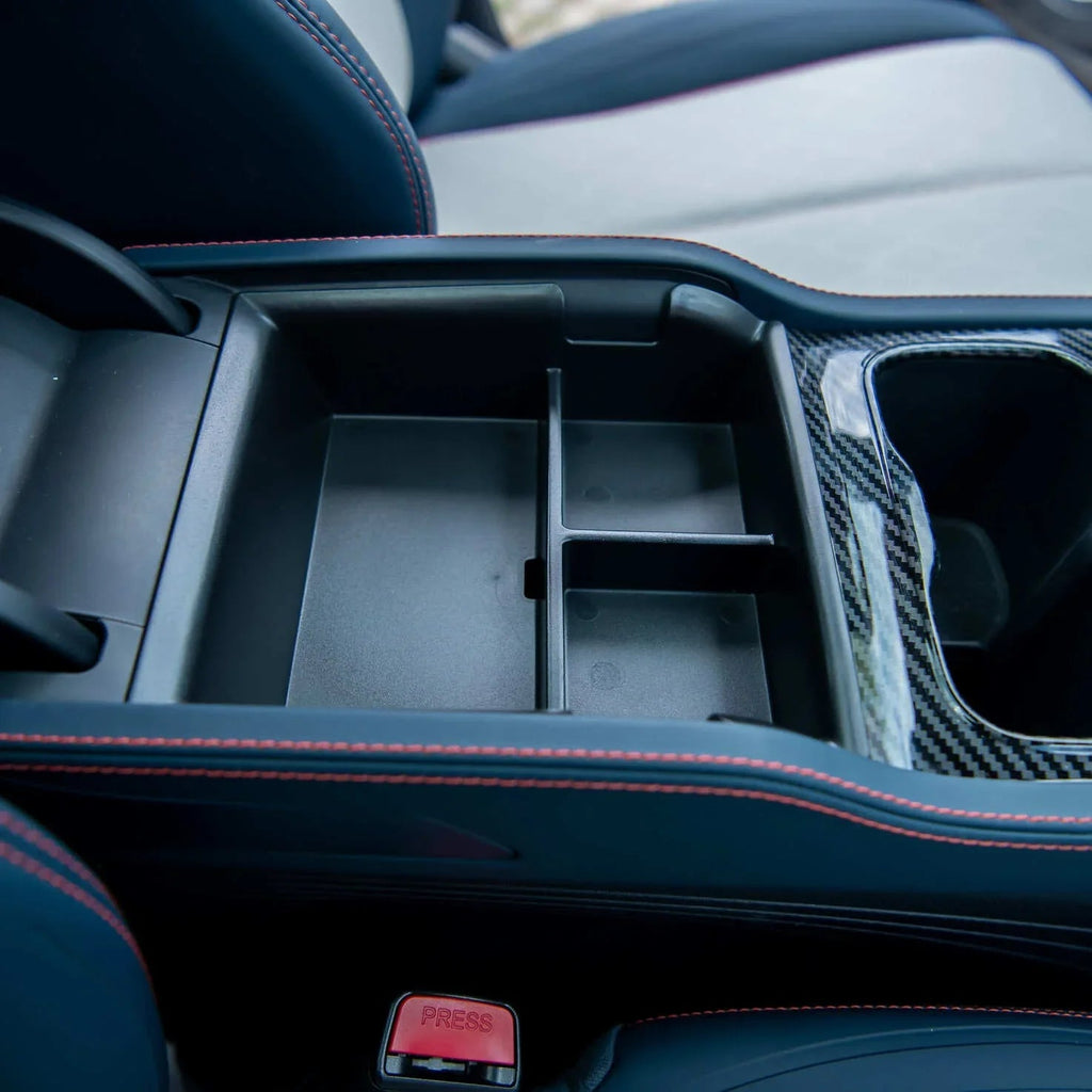 Black multi-compartment center console organizer with carbon fiber trim for BYD interior.