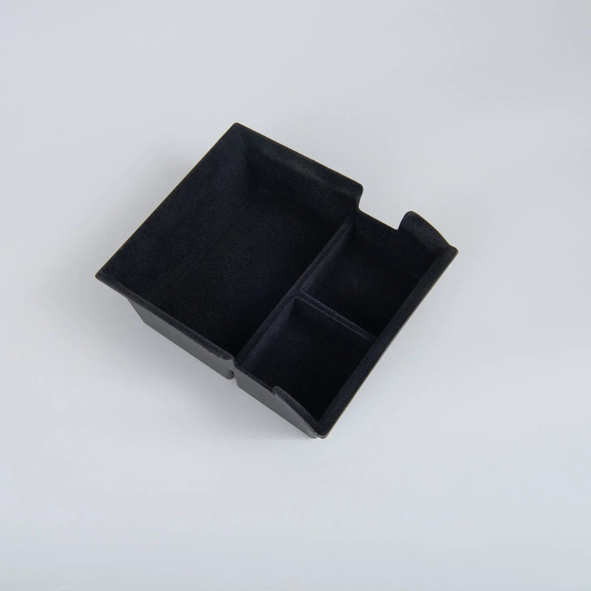 Black velvet-textured dual-compartment car center console organizer tray.