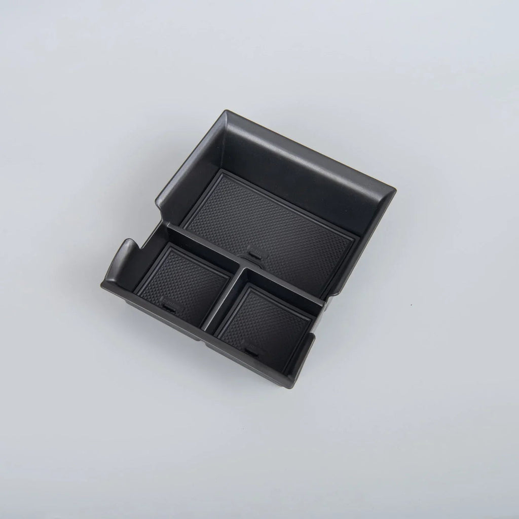 Black textured non-slip organizer tray for car center console storage.