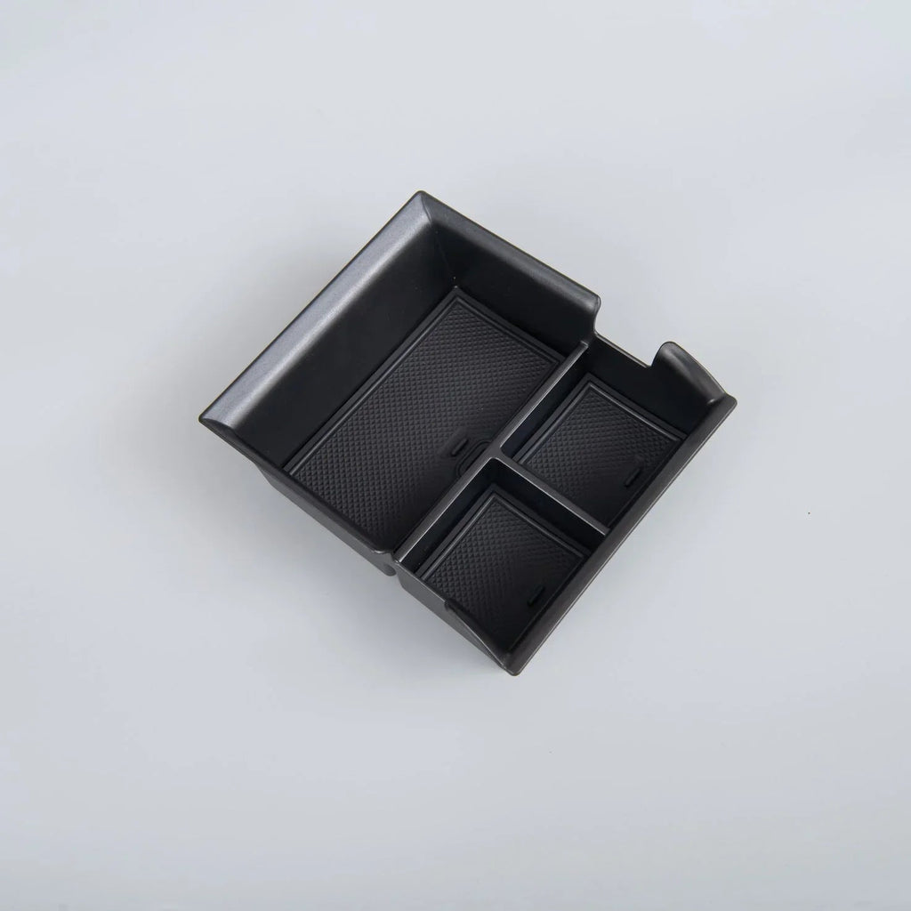 Black textured TPE car center console organizer tray for efficient storage.