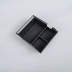 Black textured TPE car center console organizer tray for efficient storage.
