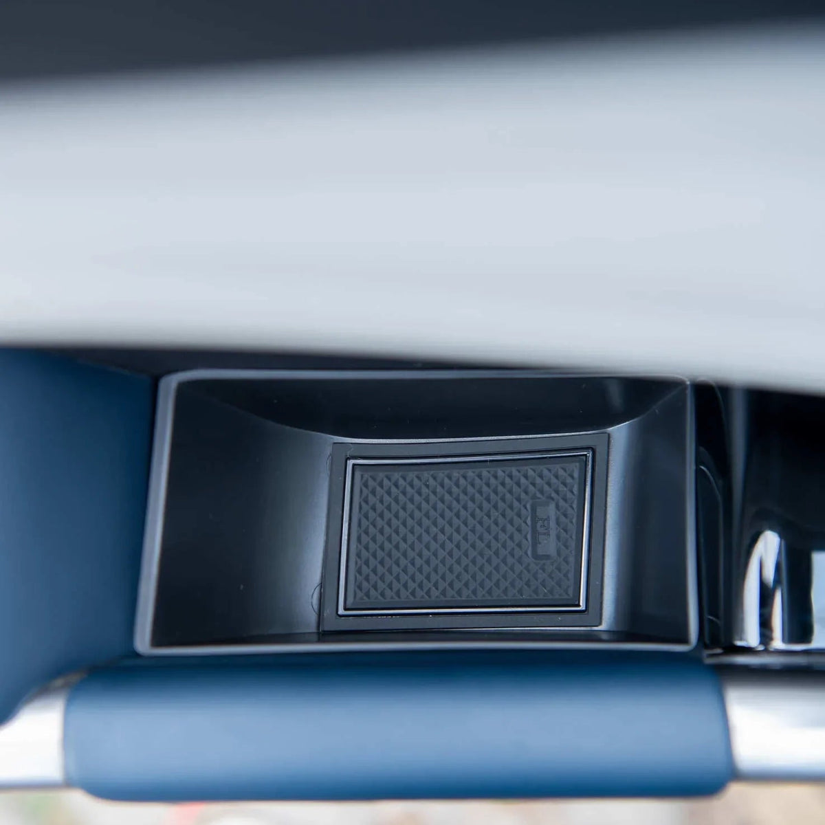 Black textured anti-slip rubber mat for BYD interior storage compartment.