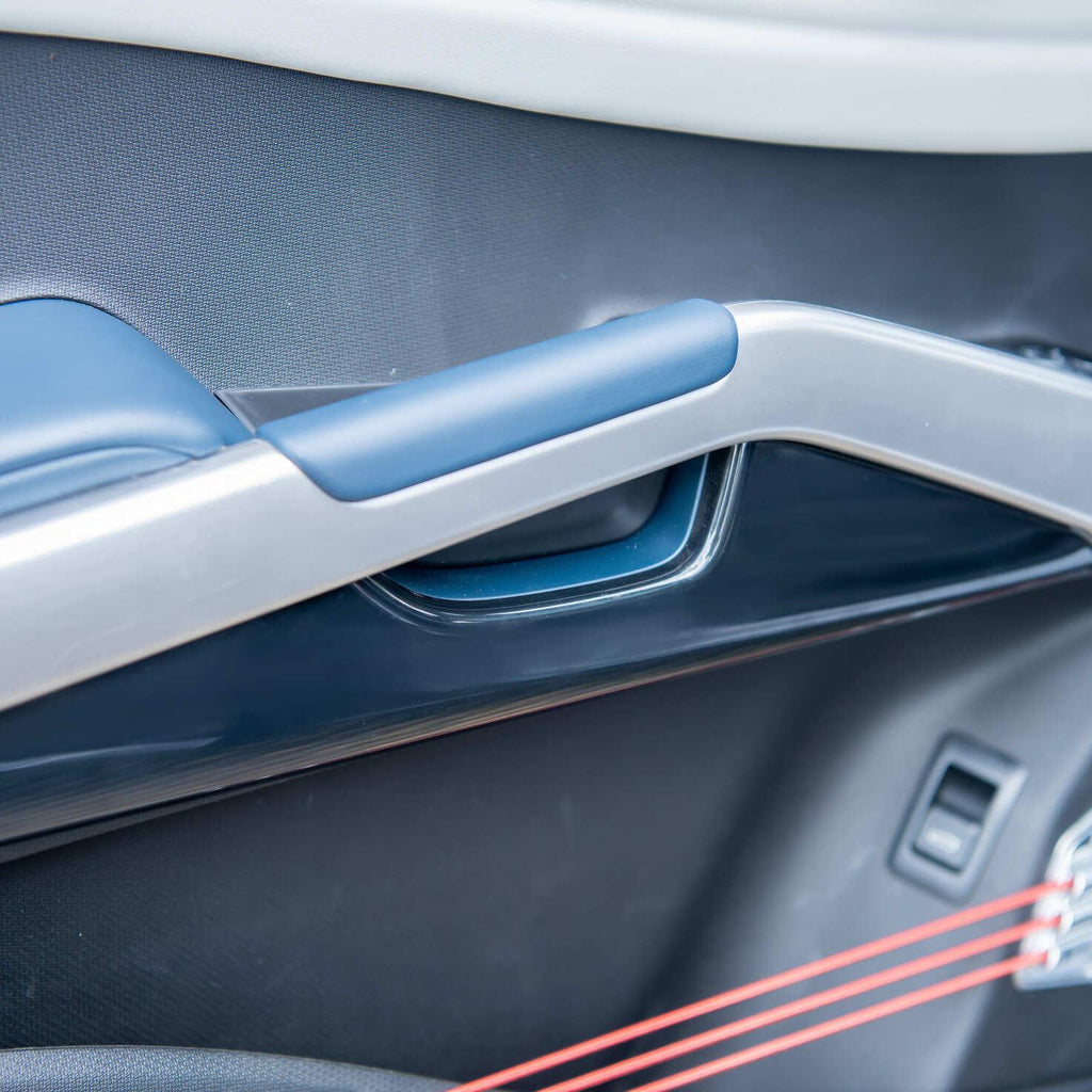 Premium blue and silver interior door trim with sleek metallic accents and soft-touch materials.