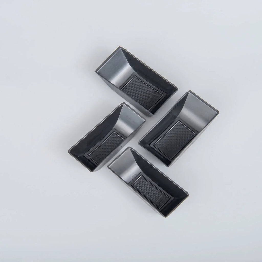 Four black textured TPE car floor mats for BYD, featuring a durable anti-slip design.