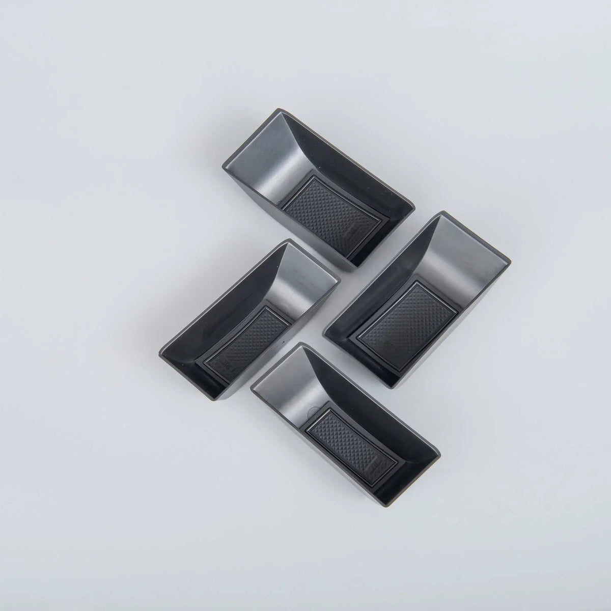 Four black textured TPE car floor mats for BYD, featuring a durable anti-slip design.