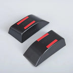 Pair of matte black protective bumper guards with distinctive red accent strips.