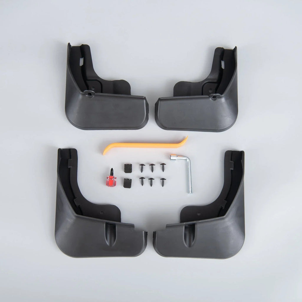 Set of four black durable rubber mud flaps with installation tools and screws for car protection.