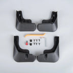 Set of four black durable rubber mud flaps with installation tools and screws for car protection.