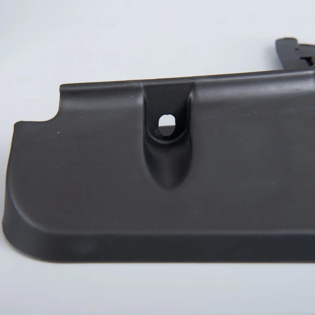 Durable matte black textured plastic automotive trim component with precision mounting hole.