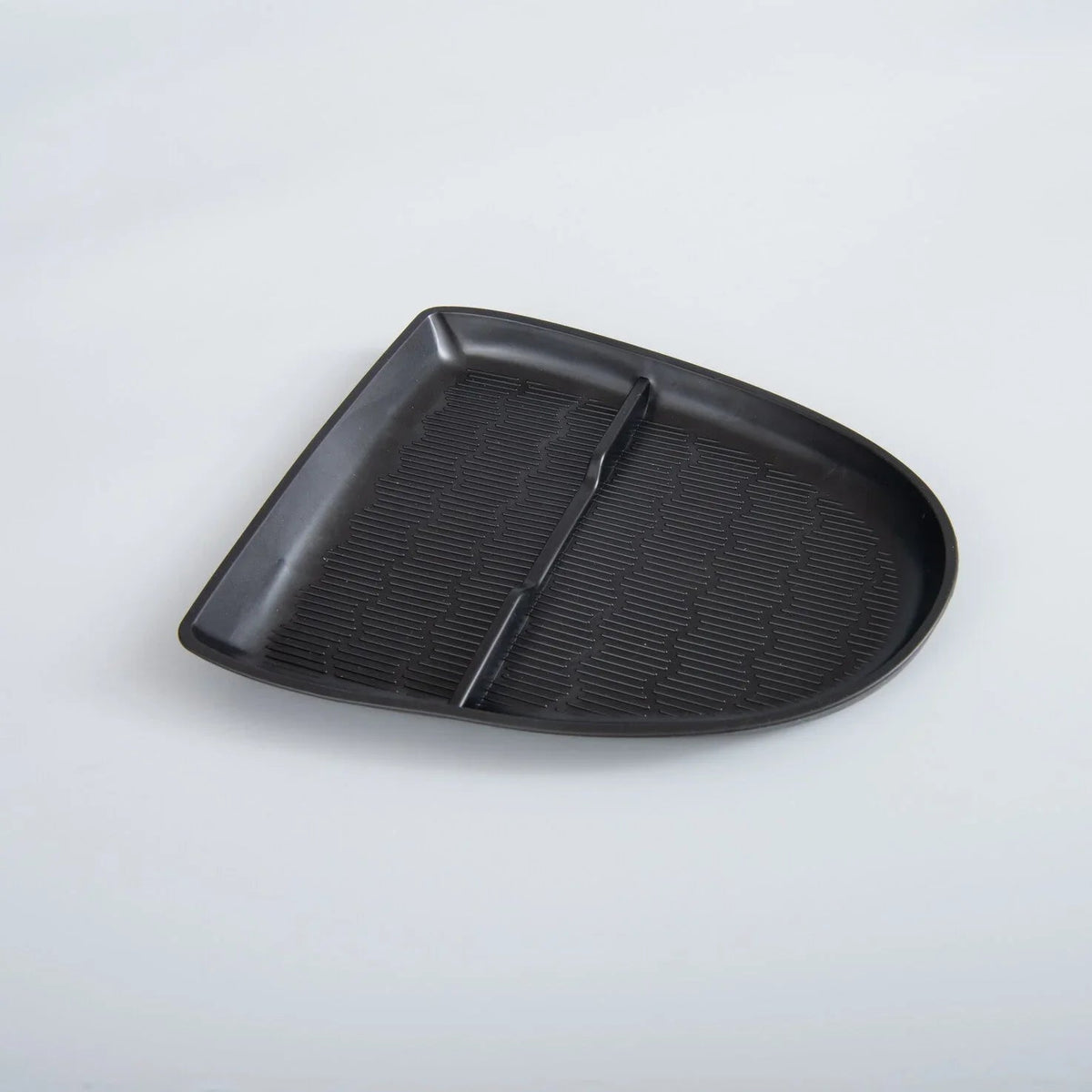 Black textured TPE car center console tray for organized storage and spill protection.