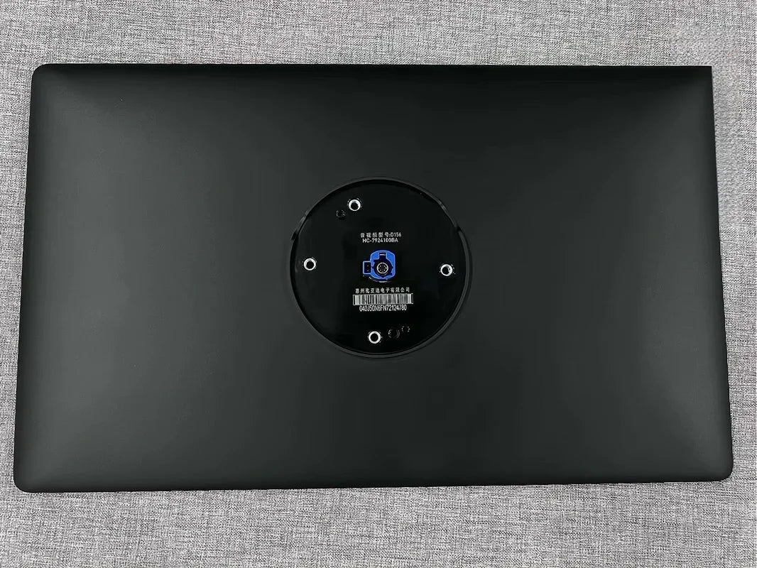 Black matte finish rear-view car camera housing with central mounting plate and screw holes.