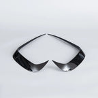 Pair of sleek, glossy black plastic automotive interior trim accents on a white background.