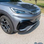 Front view of a sleek grey BYD electric car featuring modern LED headlights and alloy wheels.