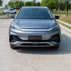Front view of a sleek grey BYD electric car featuring a glossy metallic finish.