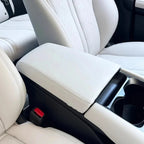 Premium white leather center armrest cover with elegant diamond stitching for car interior.