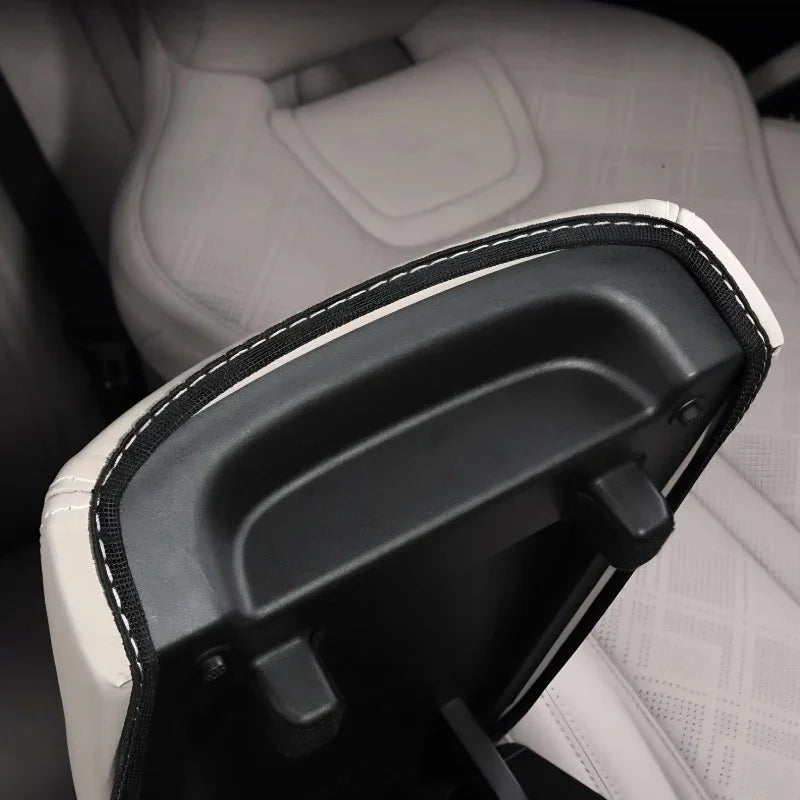 Black and white PU leather seat back organizer with protective stitching for BYD car interior.
