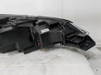 Black durable plastic automotive headlight assembly housing for BYD vehicles.
