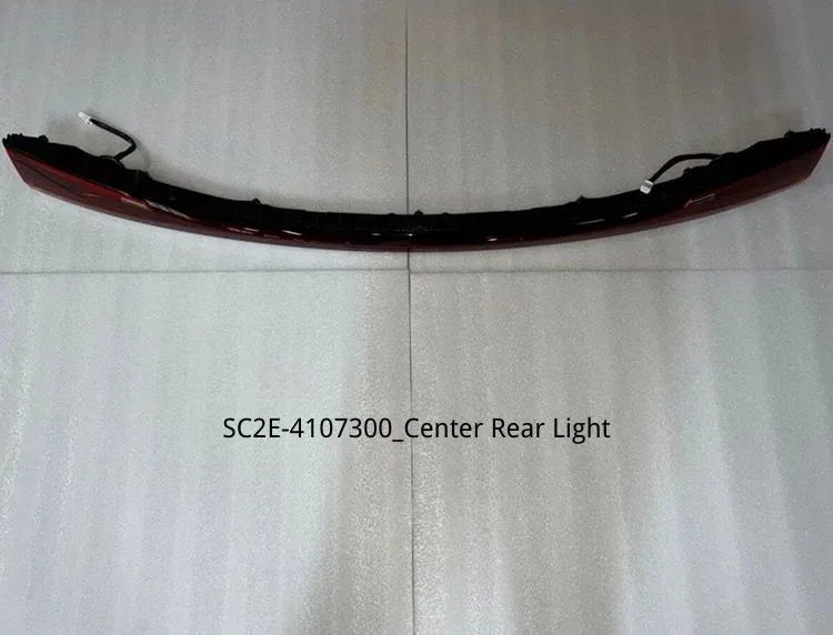 Curved red center rear light assembly for BYD with integrated wiring harness.
