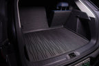 Black heavy-duty rubber cargo mat protecting the trunk of a BYD vehicle.