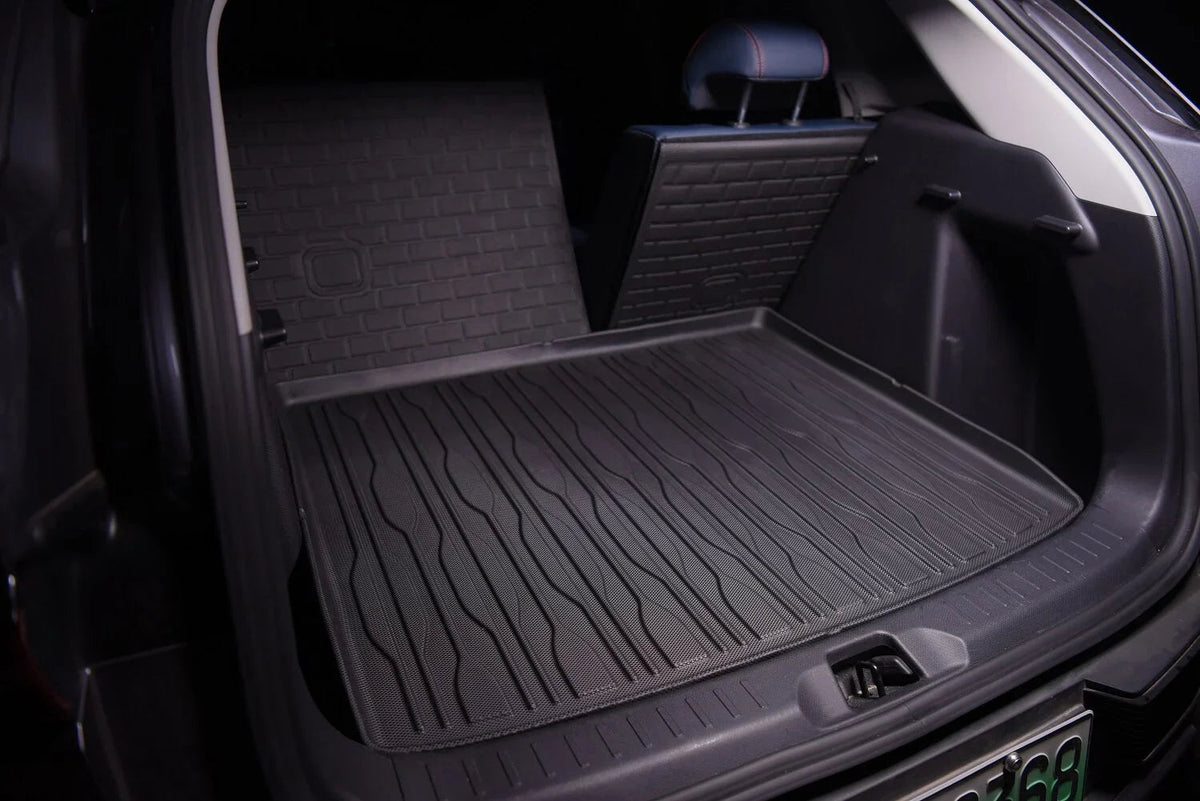 Black heavy-duty rubber cargo mat protecting the trunk of a BYD vehicle.