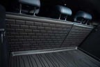 Black heavy-duty textured rubber cargo mat and matching backrest protectors for car interior protection.