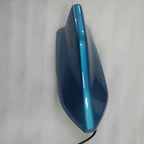 Sleek blue metallic-finish car accessory component with a smooth, aerodynamic shape.