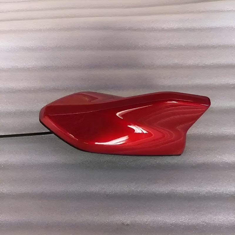 Glossy metallic red car side mirror cover with a sleek, aerodynamic design.