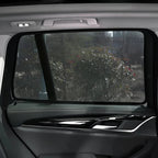 Black mesh car window sunshade for BYD vehicle providing privacy and UV protection.