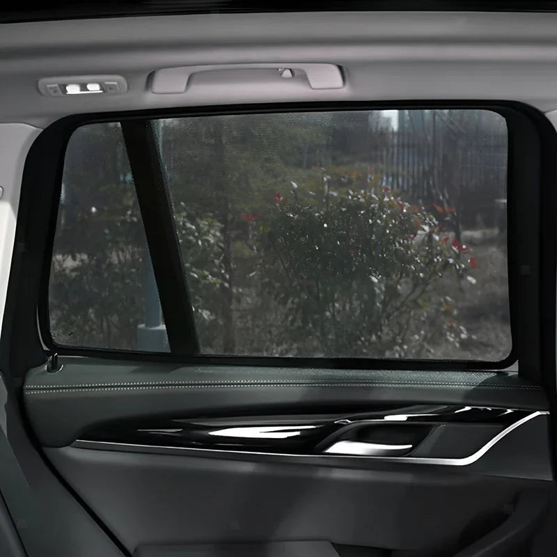 Black mesh car window sunshade for BYD vehicle providing privacy and UV protection.