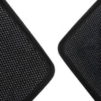 Close-up of black textured synthetic material car floor mats with reinforced edges.