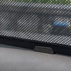 Close-up of a black mesh car sunshade with a durable fabric texture and trim.