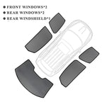 Set of charcoal grey car window and rear windshield sunshades for BYD vehicle.
