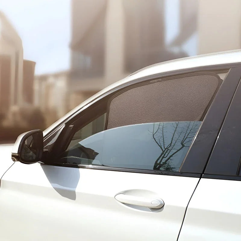Black mesh sunshade for car side window, providing UV protection and privacy.