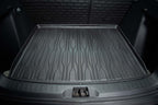 Black heavy-duty TPE rubber trunk mat with anti-slip textured grooves for car cargo protection.