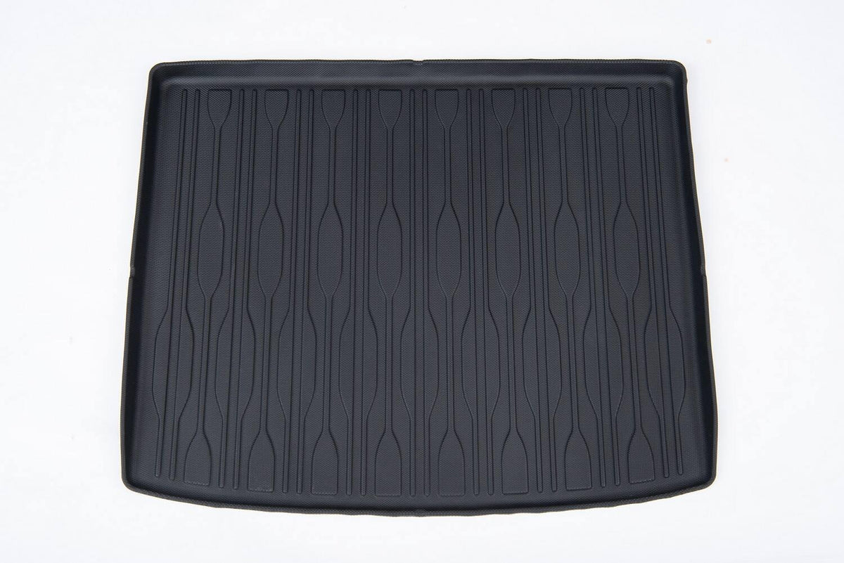 Black textured TPE trunk mat with anti-slip vertical grooves for durable car cargo protection.