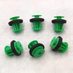 Six green and black plastic automotive trim clips for secure car panel fastening.