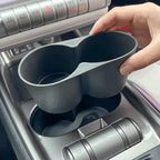Matte black dual-compartment car cup holder organizer for BYD interior.