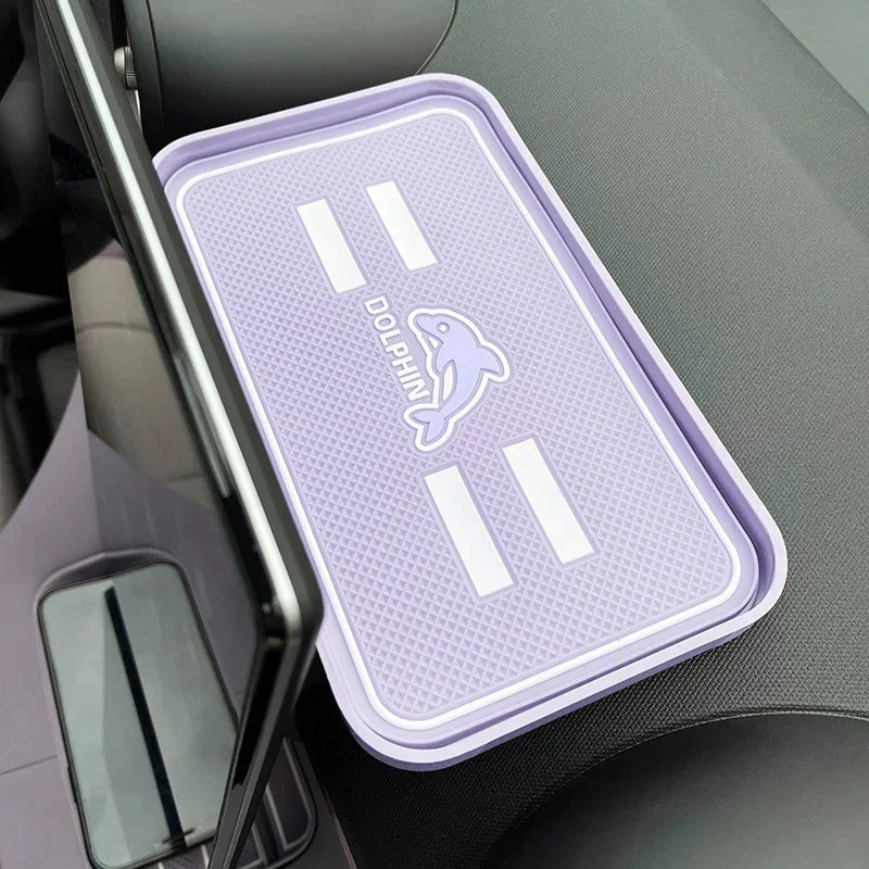 Lavender purple silicone center console tray liner with a white dolphin graphic for BYD car interior protection.