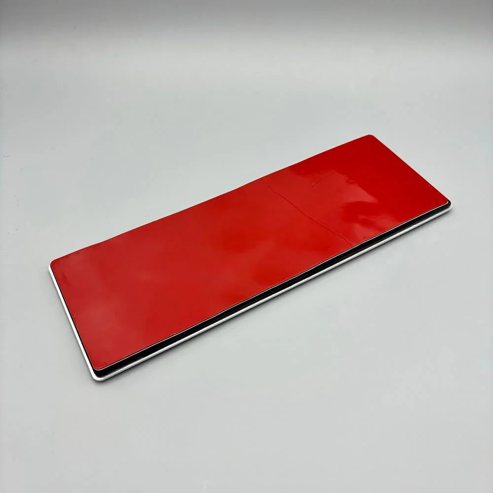 Red premium leather car interior accessory with a sleek, polished finish.