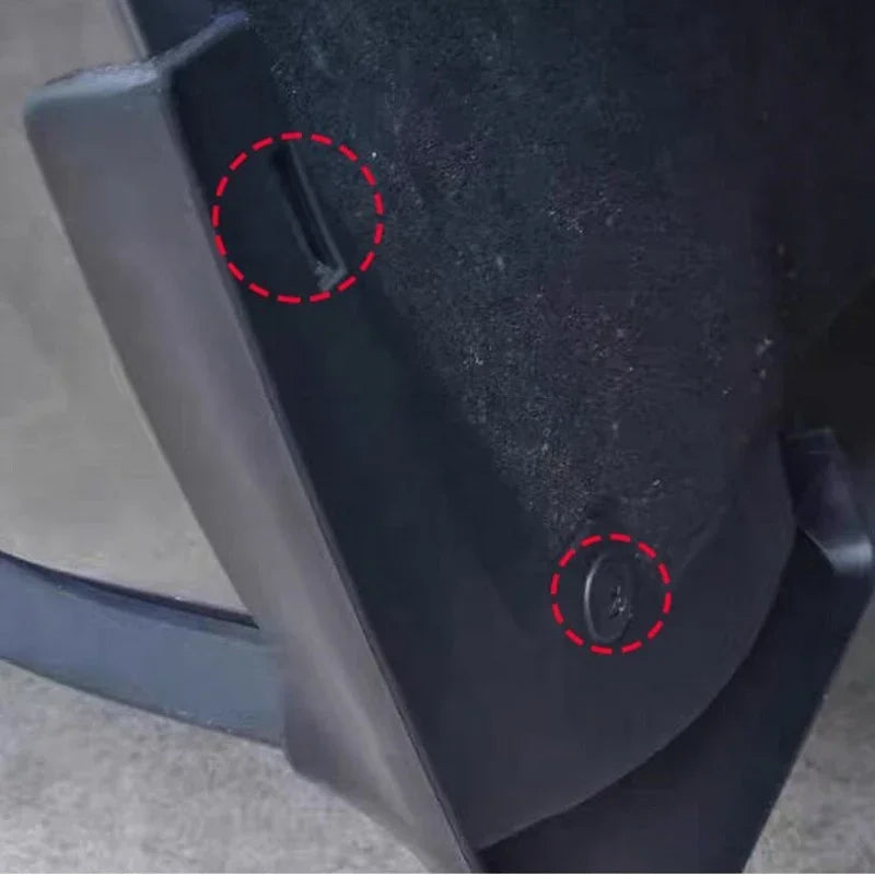 Close-up of black durable plastic car accessory with secure fastening hardware.