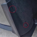 Close-up of black durable plastic car accessory with secure fastening hardware.
